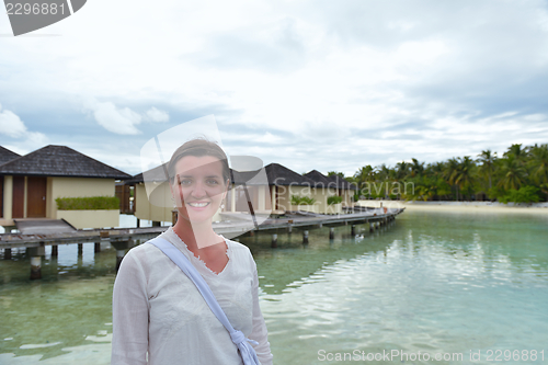 Image of young woman relax on cloudy summer day