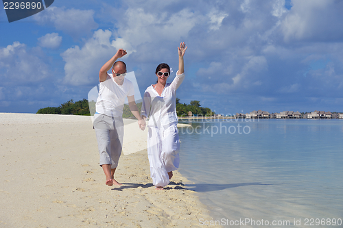 Image of happy young  couple at summer vacation have fun and relax at bea