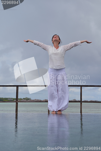 Image of young woman relax on cloudy summer day