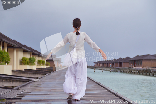 Image of young woman relax on cloudy summer day