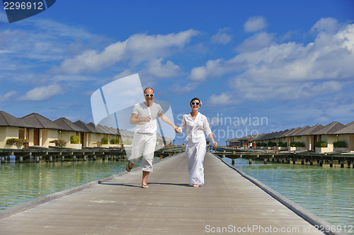Image of happy young  couple at summer vacation have fun and relax at bea