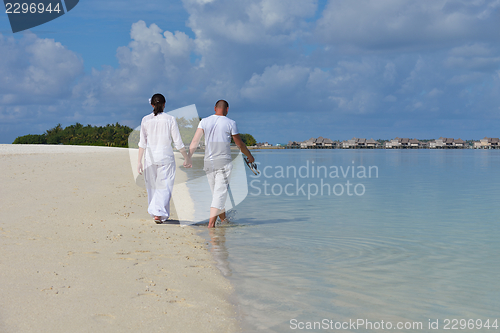 Image of happy young  couple at summer vacation have fun and relax at bea