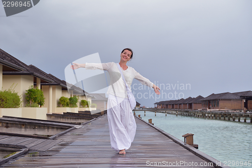 Image of young woman relax on cloudy summer day