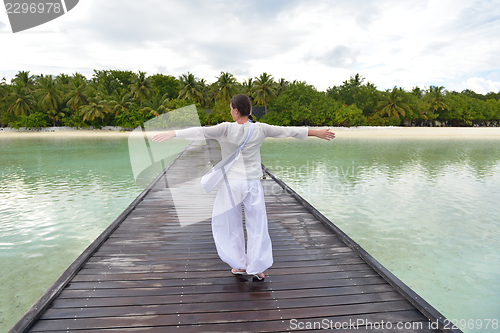 Image of young woman relax on cloudy summer day