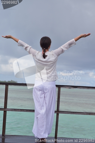 Image of young woman relax on cloudy summer day