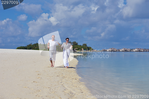 Image of happy young  couple at summer vacation have fun and relax at bea