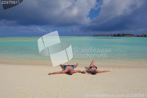 Image of happy young  couple at summer vacation have fun and relax at bea