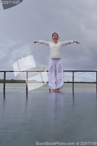 Image of young woman relax on cloudy summer day