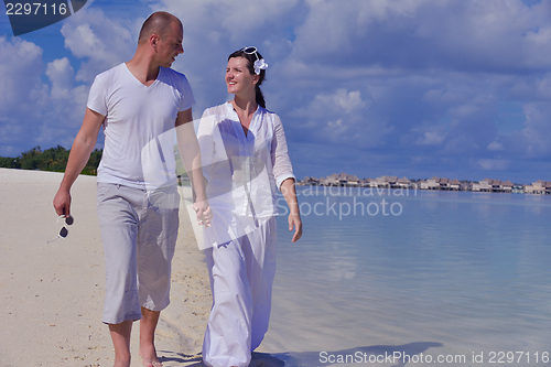 Image of happy young  couple at summer vacation have fun and relax at bea