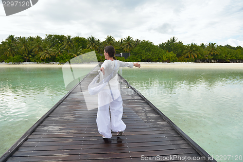 Image of young woman relax on cloudy summer day