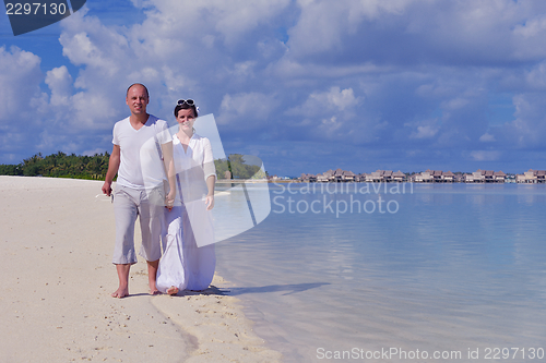 Image of happy young  couple at summer vacation have fun and relax at bea