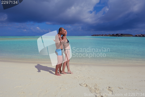 Image of happy young  couple at summer vacation have fun and relax at bea