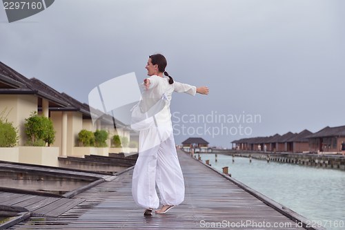 Image of young woman relax on cloudy summer day