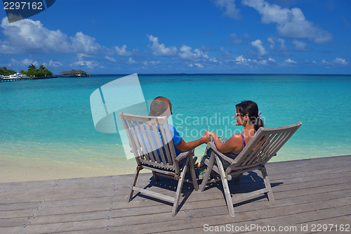 Image of happy young  couple at summer vacation have fun and relax at bea