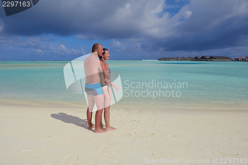 Image of happy young  couple at summer vacation have fun and relax at bea