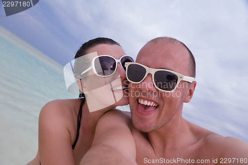 Image of happy young  couple at summer vacation have fun and relax at bea