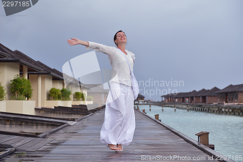 Image of young woman relax on cloudy summer day