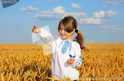 Image of small rural girl on wheat field