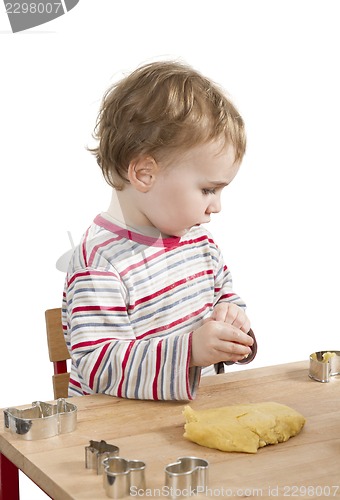 Image of child baking cookies isolated on white background