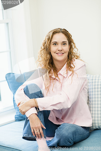 Image of Woman relaxing by the window