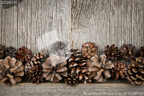 Image of Rustic wood with pine cones