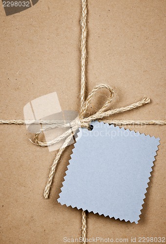 Image of Gift with blue card in brown paper