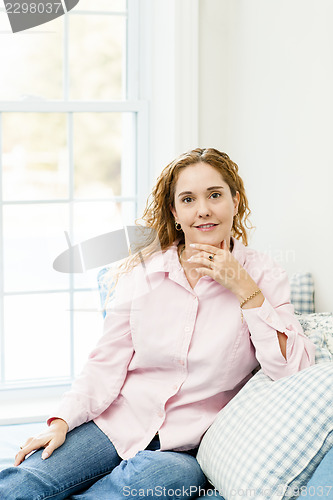 Image of Woman relaxing by the window