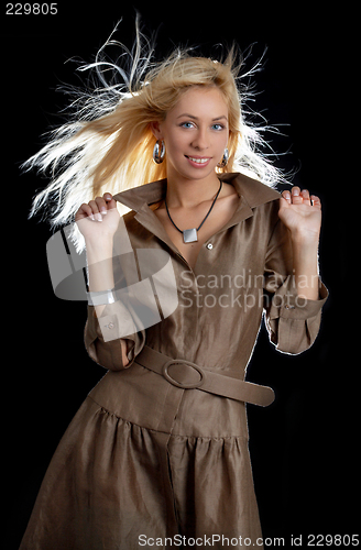 Image of dancing blond in brown dress