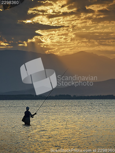Image of Fisherman at sunrise 