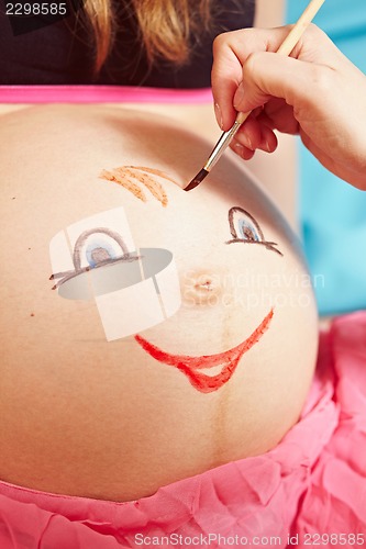 Image of Pregnant girl with a picture