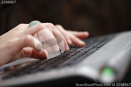 Image of Young woman working on laptop