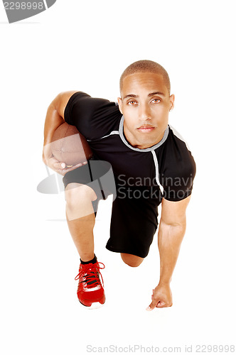 Image of Football player kneeling.