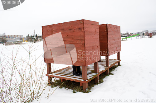 Image of beach dressing cabin snow woman legs shoes winter 