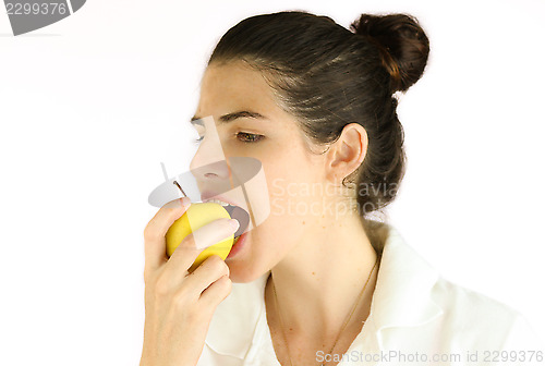Image of Girl taking a bite of an apple.