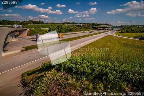 Image of clover leaf exit ramps on highway near city