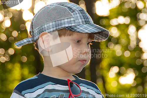 Image of little boy in a cap