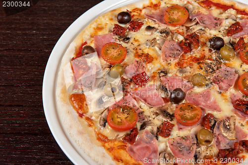 Image of pizza with ham and mushrooms