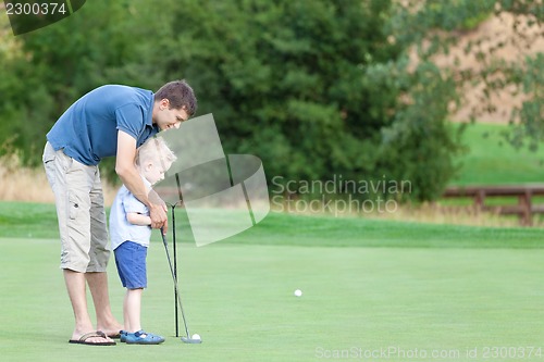 Image of family of two at the golf course