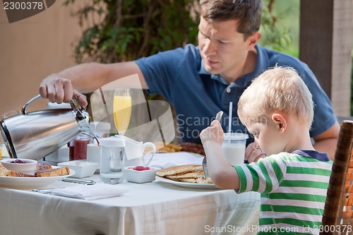 Image of family at breakfast