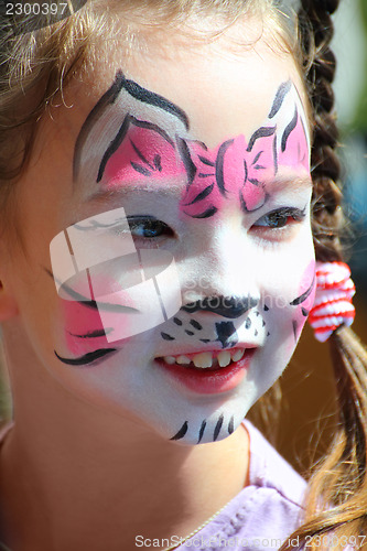 Image of cute little girl with cat makeup