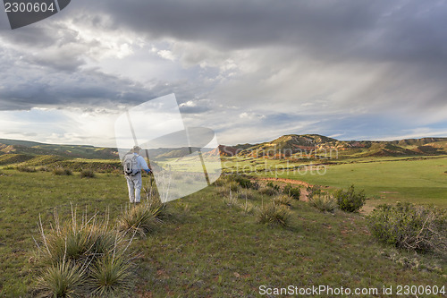 Image of hiker and Red Mountain