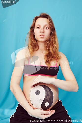 Image of Pregnant girl with a picture