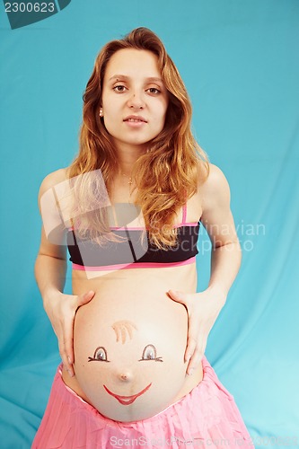 Image of Pregnant girl with a picture