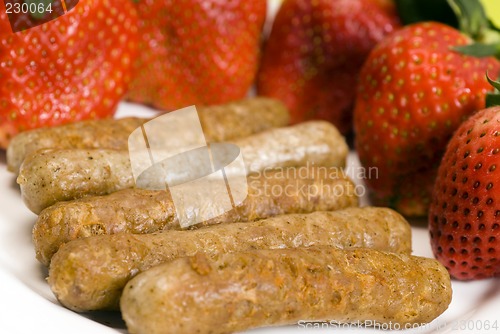 Image of pork sausage links with strawberries