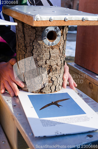 Image of seller hands handmade bird house nesting box 