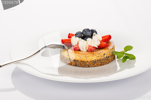 Image of Cheesecake, blueberries and strawberries