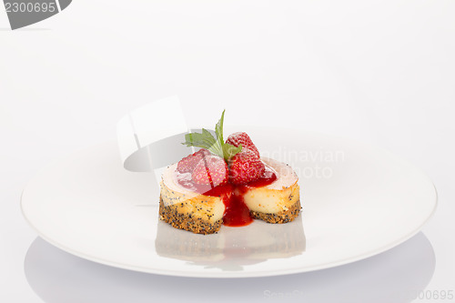 Image of Cheesecake, strawberry, coulis and mint