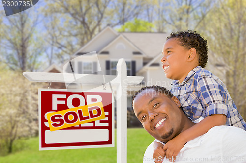 Image of Mixed Race Father and Son In Front of Real Estate Sign and House