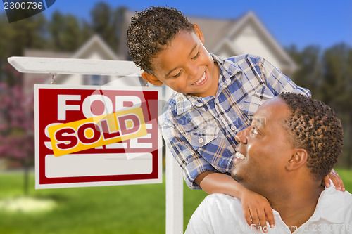 Image of Mixed Race Father and Son In Front of Real Estate Sign and House