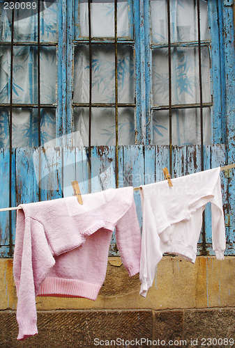 Image of Sweater and t-shirt hanging on a clothes line
